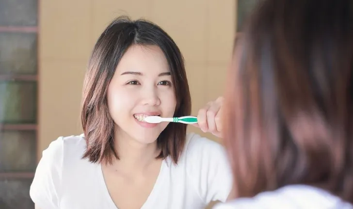 What is "dry brushing" and why is it better than regular brushing?